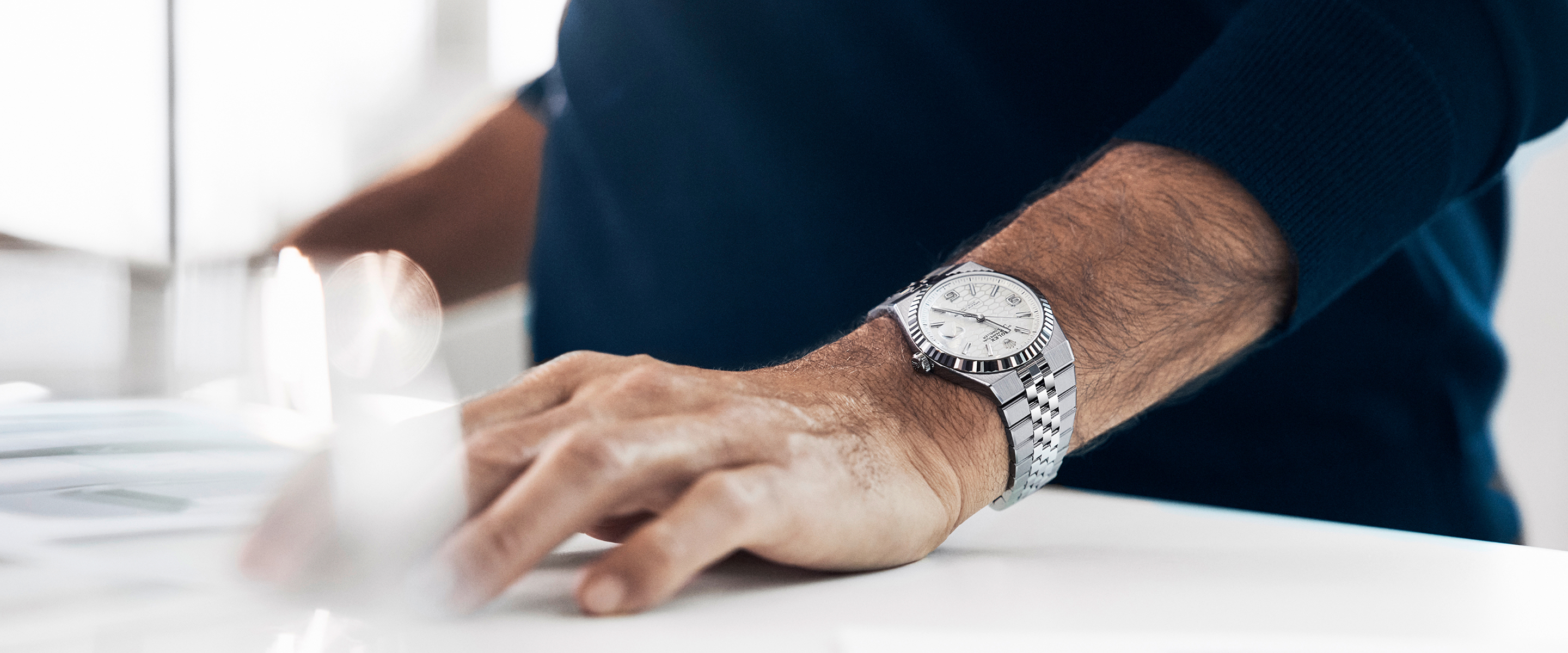 Rolex Land-Dweller in Edelstahl am Handgelenk von Roger Federer